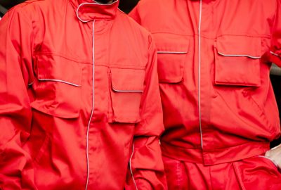 Close-up of a red working uniforms of auto mechanics